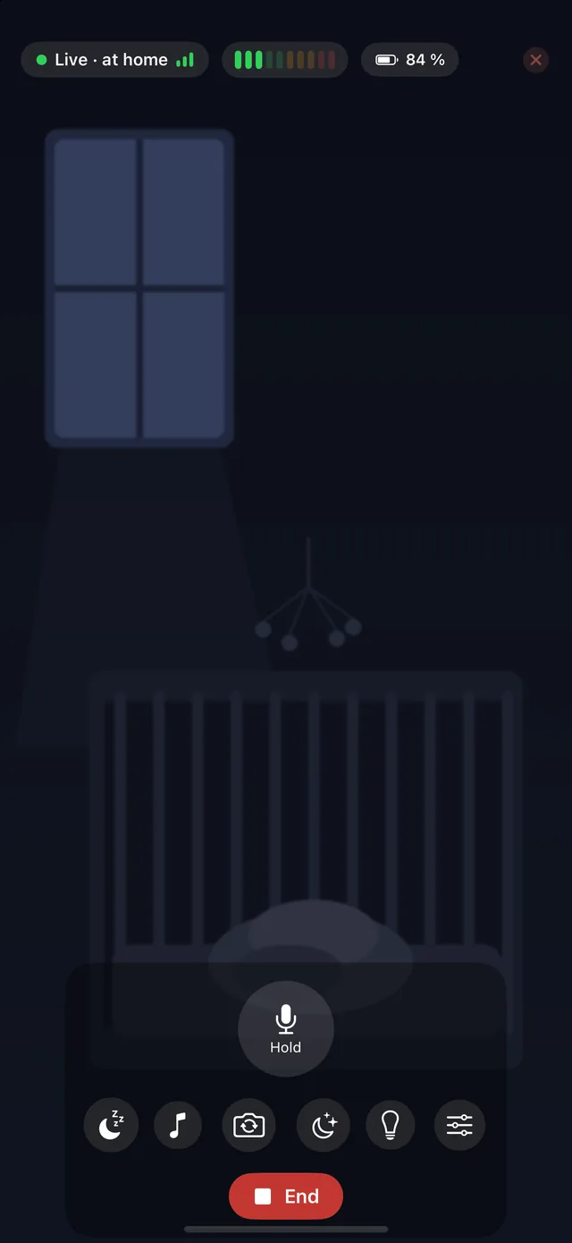 HeyFini parent unit: live view of the dark nursery with sound level, baby unit battery and talk button